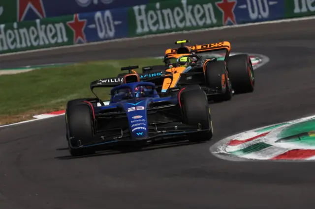 Alex Albon in front of a McLaren during qualifying