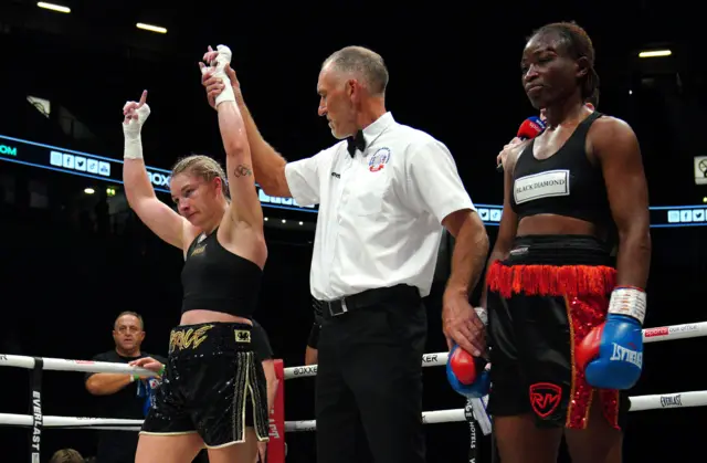 Lauren Price (left) celebrates victory against Lolita Muzeya