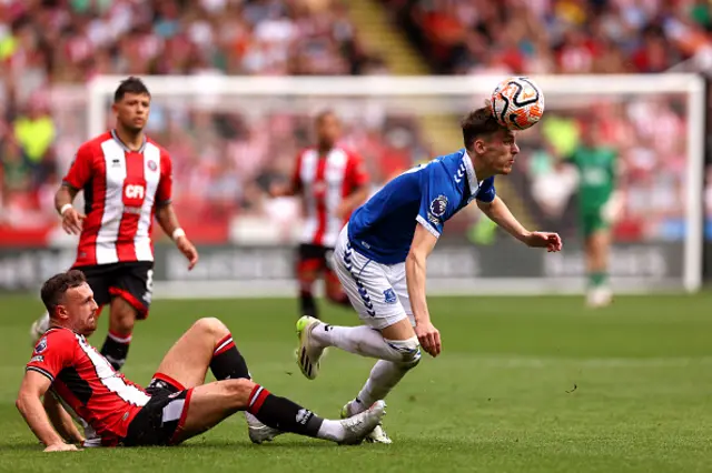 James Garner of Everton is tackled by Jack Robinson