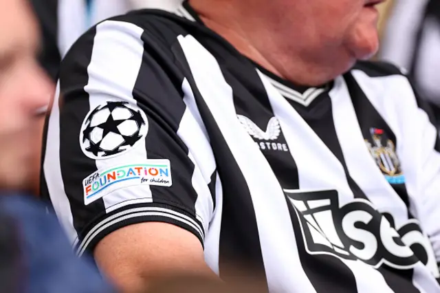 Newcastle fan with UCL emblem on the shirt