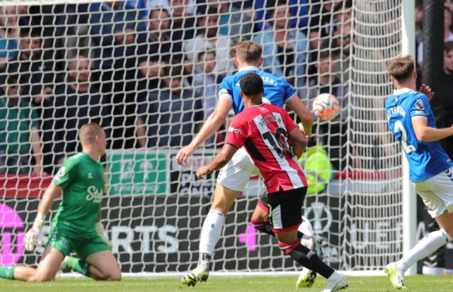 Cameron Archer watches has his ball goes past Jordan Pickford