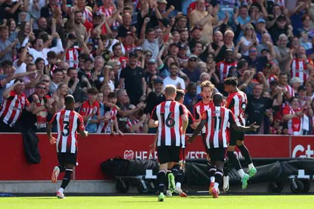 Matthias Jensen celebrates with teammates after scoring