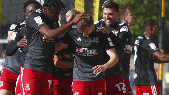 Exeter celebrate scoring goal