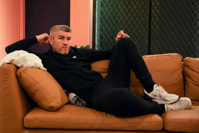 Liam Smith relaxing on a sofa