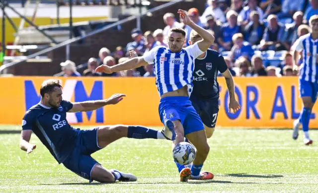 Ross County's Connor Randall fouls Kilmarnock's Kyle Magennis