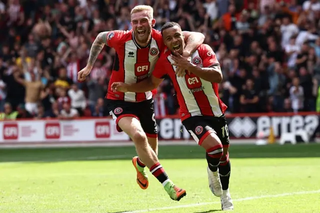 McBurnie and Archer celebrate arm in arm