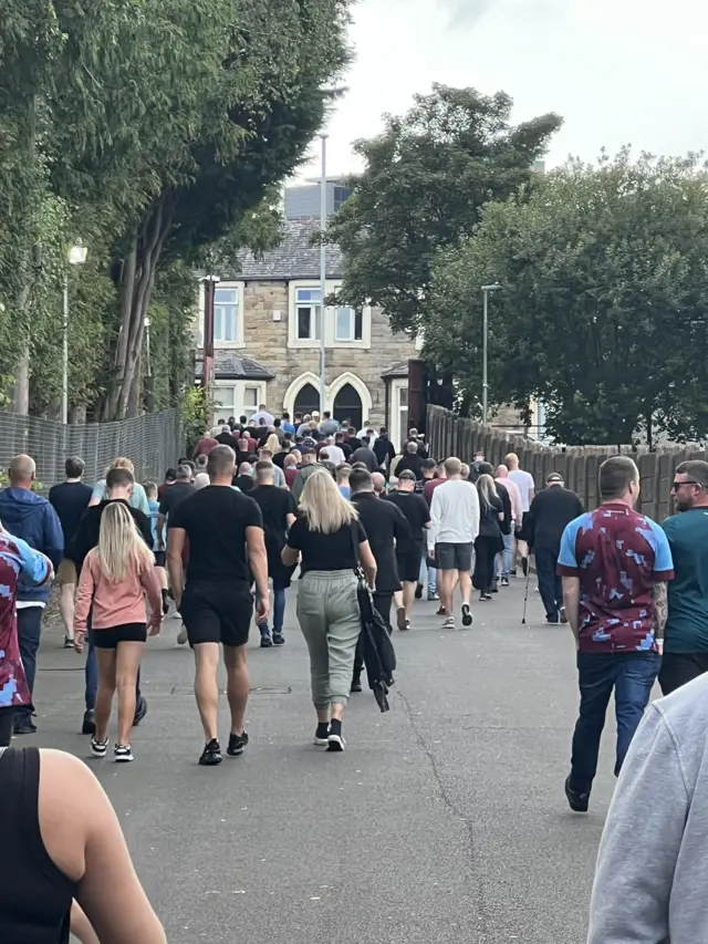 Burnley fans trudge out of Turf Moor.