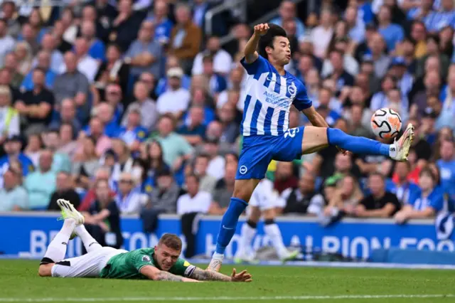 Mitoma dribbles past Trippier leaving him on the floor.