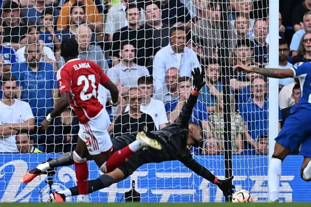 Anthony Elanga scores the opening goal past Chelsea's Spanish goalkeeper Robert Sanchez