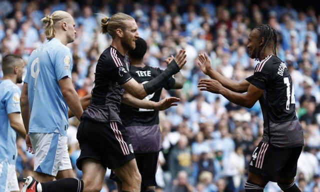 Tim ream celebrates with a teammate after scoring