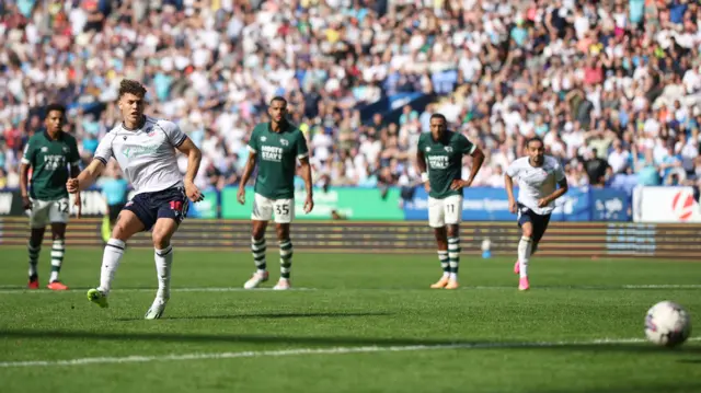 Dion Charles scores a penalty for Bolton