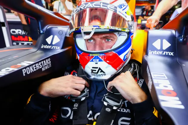 Max Verstappen sits in the cockpit of the Red Bull at Monza