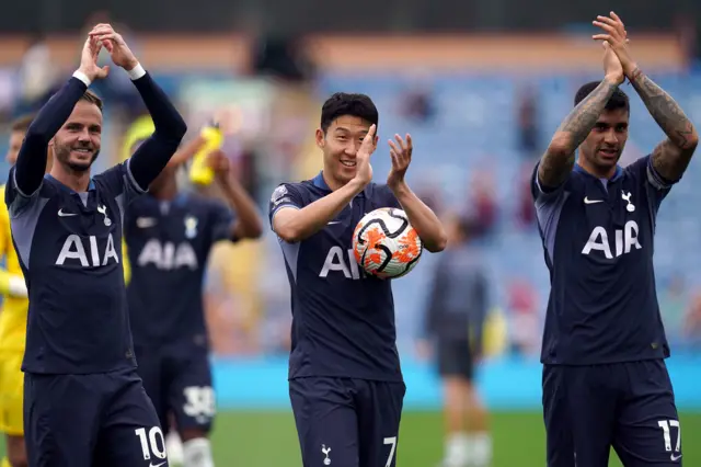 Son with matchball in hand, Maddison, and Romero applaud the travelling fans.