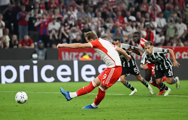 Harry Kane of Bayern Munich scores their sides third goal from the penalty spot