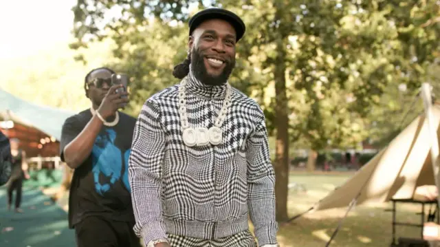 Burna Boy at the Burberry Spring 2024 Ready To Wear Fashion Show held at Highbury Fields on September 18, 2023 in London, England