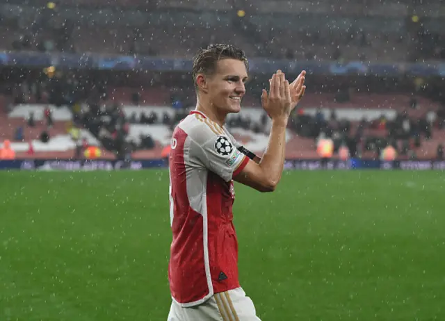 Martin Odegaard applauds the Arsenal fans after the game