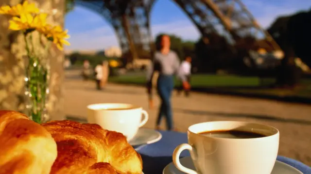 A croissant and coffee breakfast by the Eiffel Tower