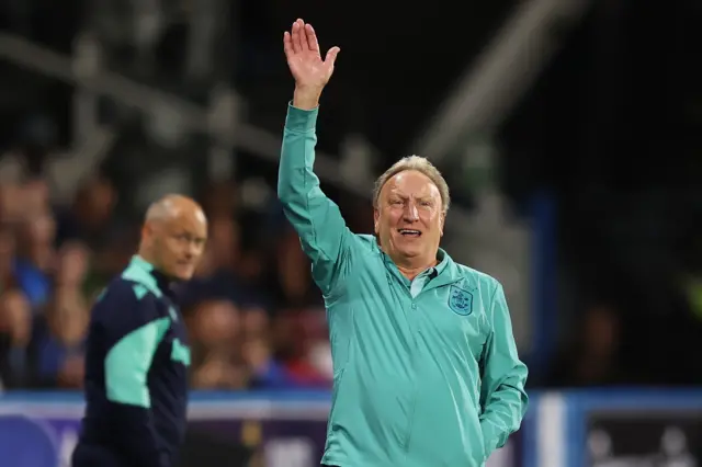 Neil Warnock waves on at Huddersfield