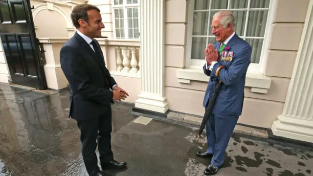 King Charles and Macron smile at each other