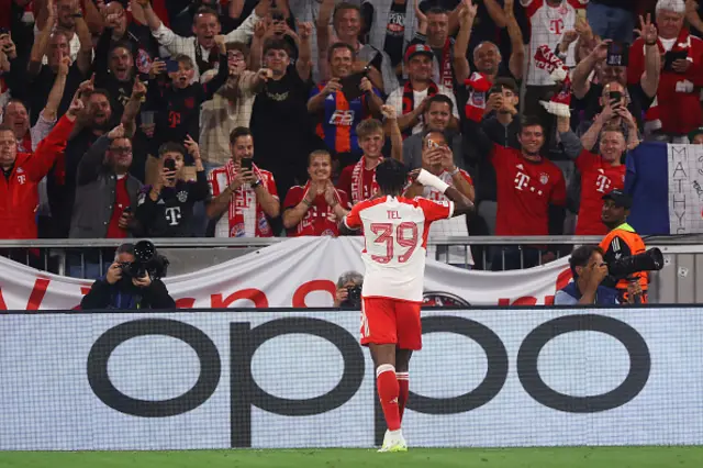 Mathys Tel of Bayern Munich celebrates with fans