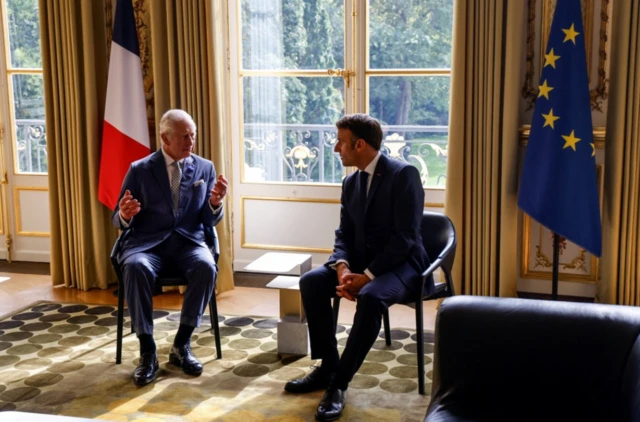 King and Macron in the Élysée Palace