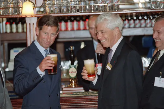 Prince Charles and the chairman of the Galeries Lafayette department store share a pint on the occasion of a promotion campaign for British products, 1995