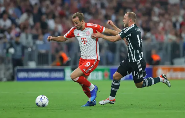 Harry Kane of FC Bayern München holds off a challenge from Christian Eriksen