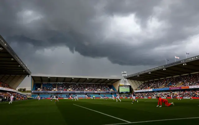 The Den under heavy skies