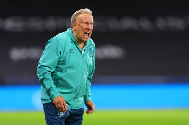 Neil Warnock runs the line at Huddersfield v Stoke