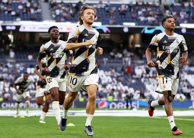 Luka Modric warms up before kick-off