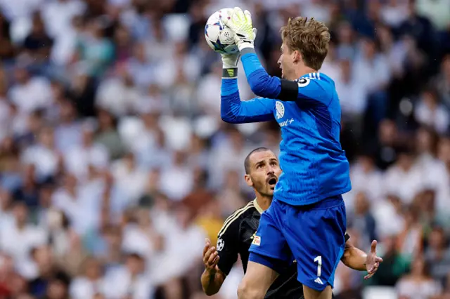 Union Berlin's Danish goalkeeper Frederik Ronnow jumps