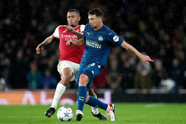 Gabriel Jesus of Arsenal and PSV Olivier Boscagli clash for the ball