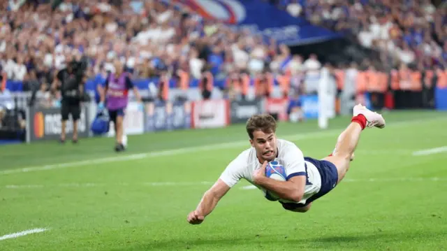 Damian Penaud of France scoring a try in the Rugby World Cup game against New Zealand