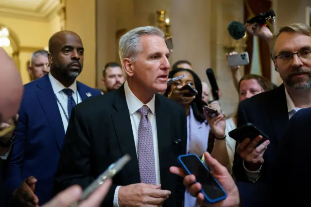 Kevin McCarthy speakers with reporters inside the US Capitol