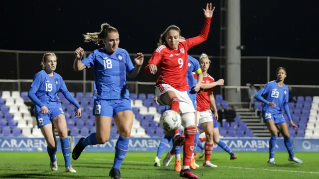 Kayleigh Green and Guðrún Arnardóttir compete for the ball