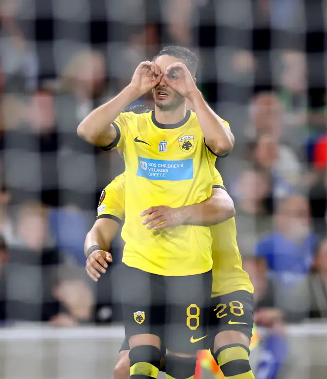 Gacinovic mimicks glasses in celebration of his goal at Brighton.