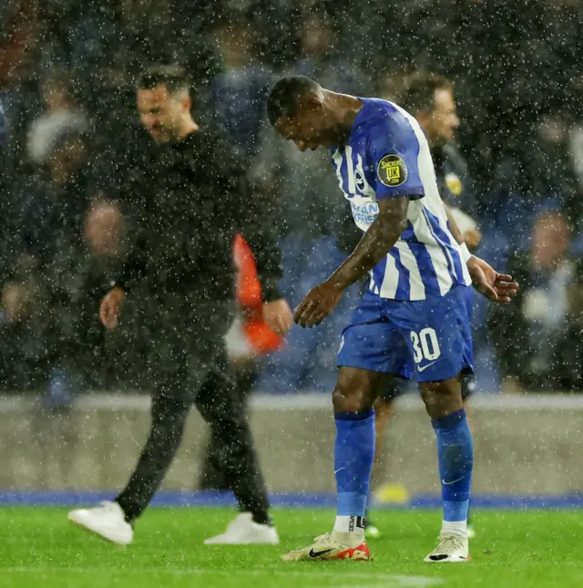 Estupinan and De Zerb trudge glumly to thank the fans after defeat.