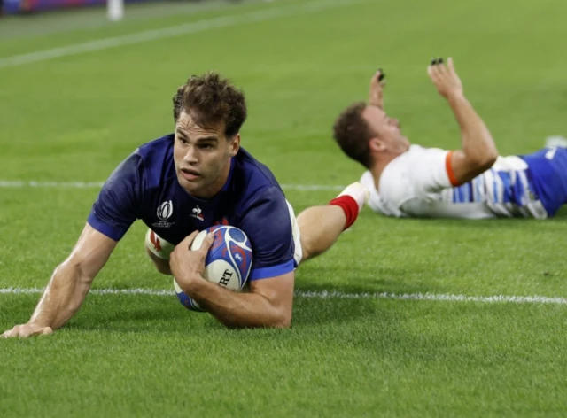 Damien Penaud crashes over the line with the ball in his hand to score again