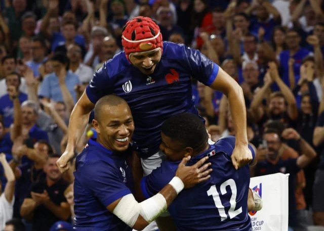 France's Jonathan Danty celebrates scoring their second try with teammates