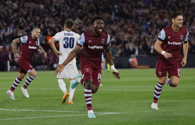 Kudus celebrates with is arms out wide after scoring a second for west ham.