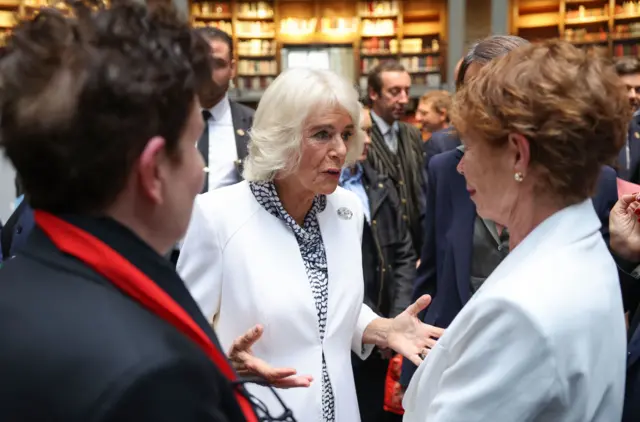 Queen Camilla speaking to Celia Imrie