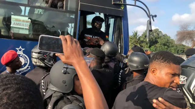 The police arresting protesters in Accra, Ghana