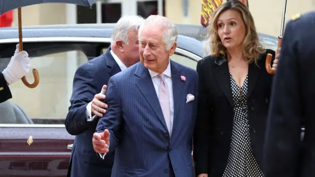 Britain's King Charles, next to President of the French National Assembly Yael Braun-Pivet (R), arrives to address Senators and members of the National Assembly at the French Senate, in Paris on September 21, 2023. Britain's King Charles III and his wife Queen Camilla are on a three-day state visit starting on September 20, 2023, to Paris and Bordeaux, six months after rioting and strikes forced the last-minute postponement of his first state visit as king