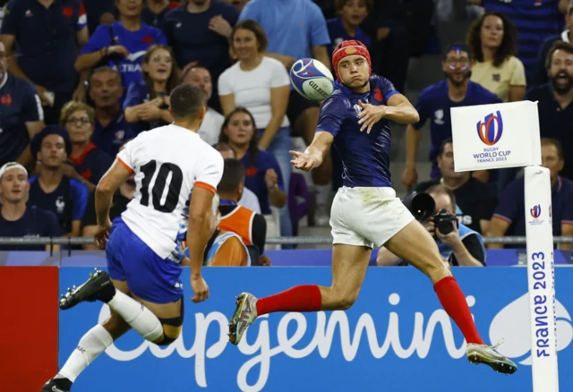 Bielle-Biarrey jumps up and passes the ball back on the pitch for Danty