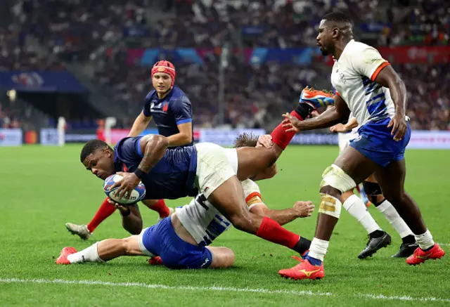 Jonathan Danty of France scores his team's fifth try