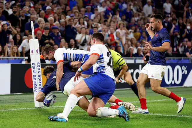 Damian Penaud of France scores his team's tenth try