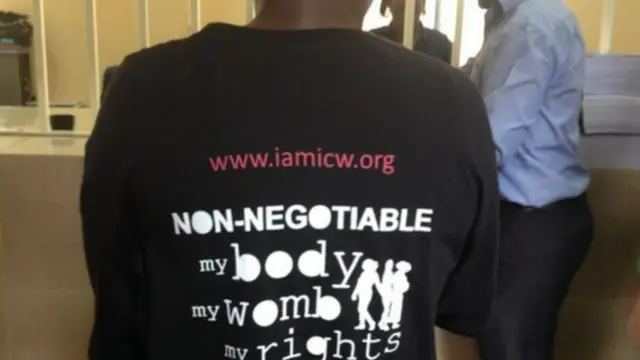 Woman wearing a t-shirt with messaging about body rights