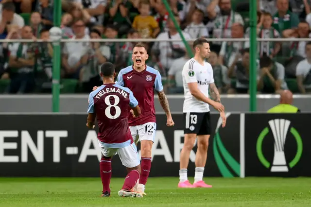 Lucas Digna chest bumps Tielemans after equalising for Villa.