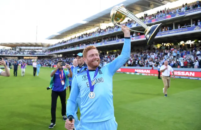 England's Jonny Bairstow lifts the Cricket World Cup trophy aloft at Lord's after their success in 2019