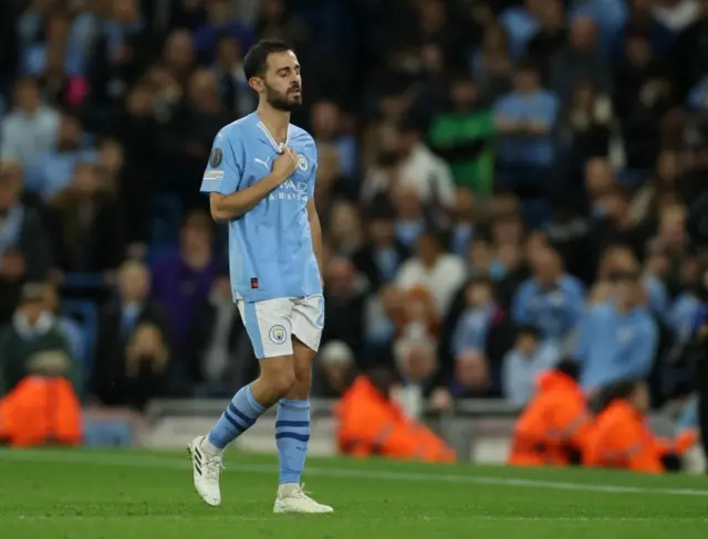 Manchester City's Bernardo Silva leaves the field after an injury against Red Star Belgrade